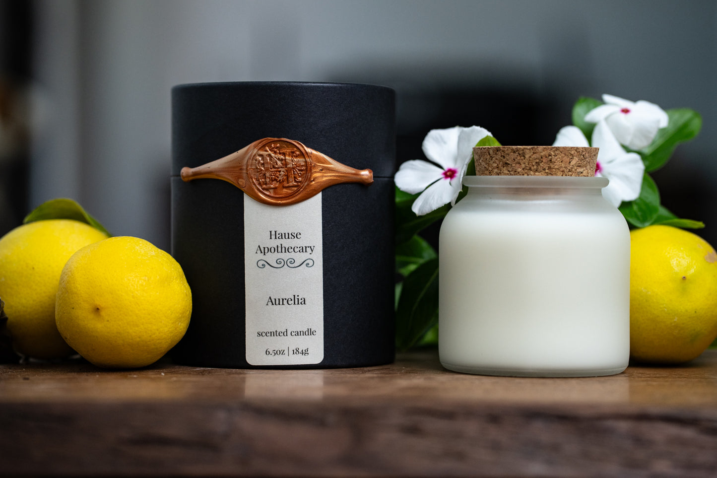 Frosted glass candle in kraft tube packaging with wax seal